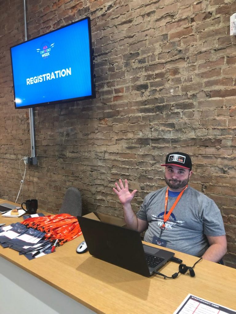 Matt waves hi from the Startup Cincy Week registration desk